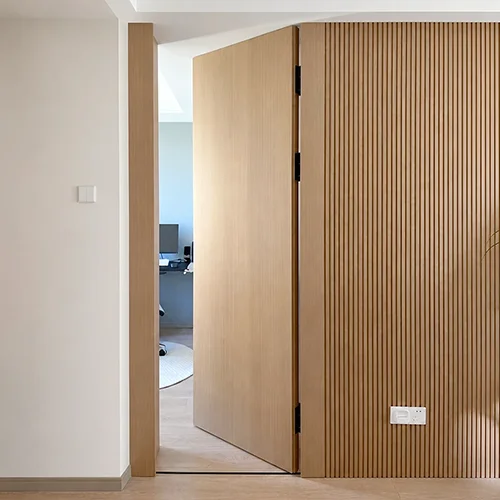 Minimalist floor to ceiling trimless wood door