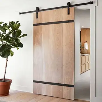 Internal solid wood sliding barn doors for laundry closet