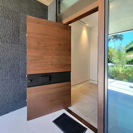 Modern exterior solid wood flush pivoting front door with black inlay handle